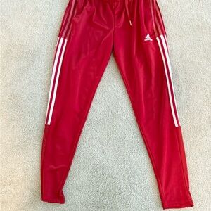 Adidas womens Red Joggers with White Stripes.  Size small